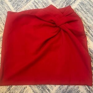 Maeve, red bow style skirt.